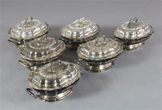 A set of six 19th century Sheffield plated entreé dishes, covers and handles and two handled heater bases